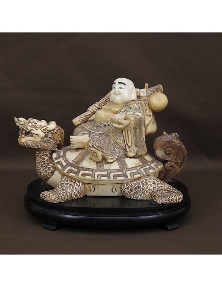 Sculpture sur os: Bouddha sur tortue tête de dragon 27cm avec socle